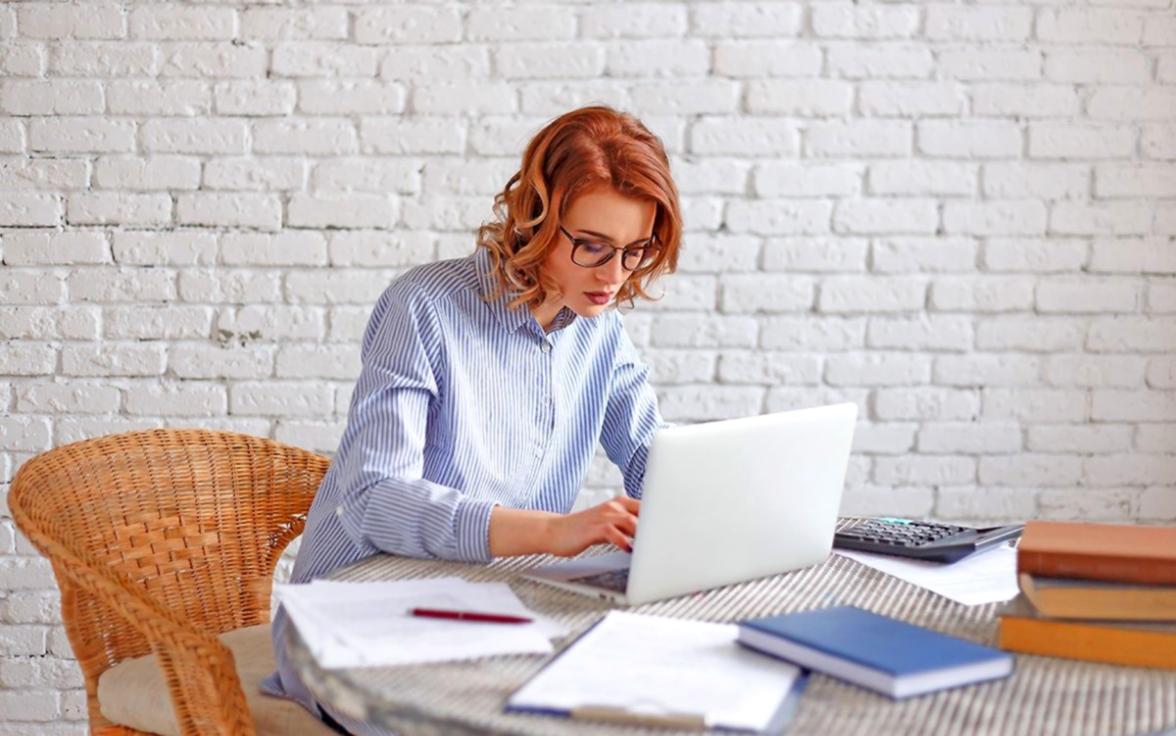 Multi-monitor editing setup displaying timeline workflow and source footage